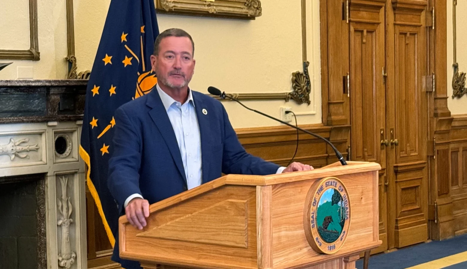 New Indiana Commerce Secretary Chuck Goodrich takes questions in the governor's office.