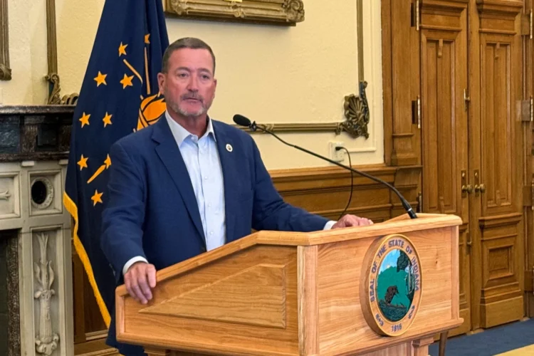 New Indiana Commerce Secretary Chuck Goodrich takes questions in the governor's office.