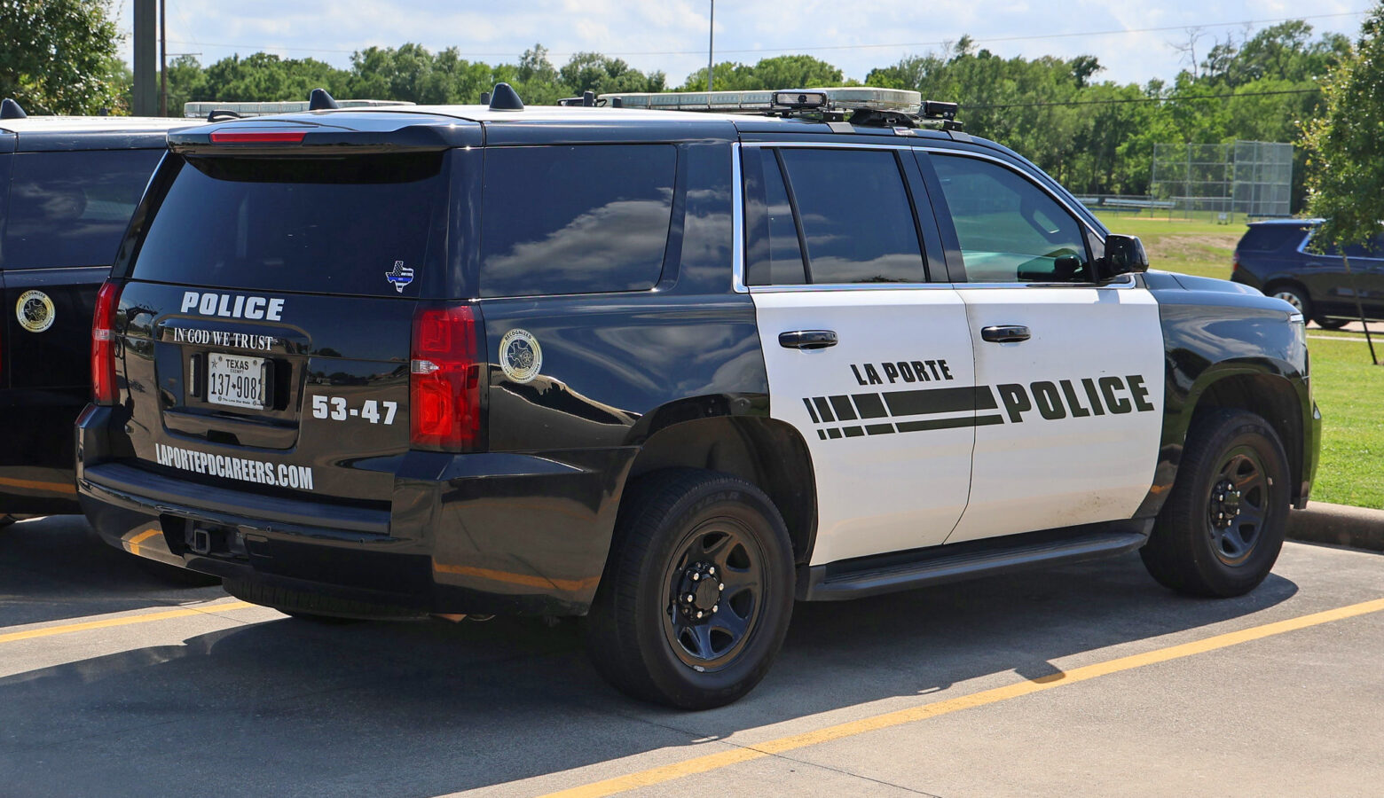 A police SUV in LaPorte, TX, includes an "In God We Trust" message on the tailgate.