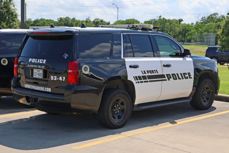 A police SUV in LaPorte, TX, includes an "In God We Trust" message on the tailgate.