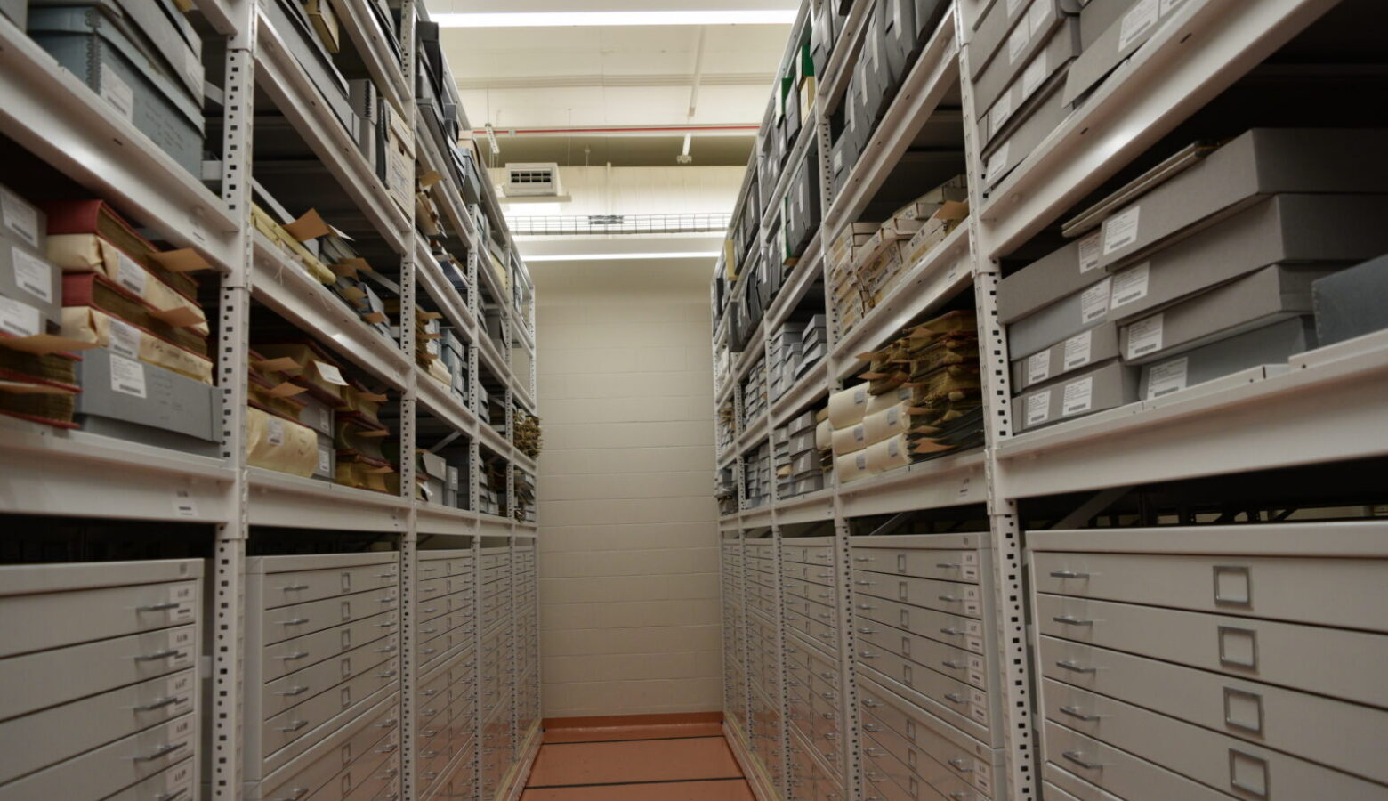 Shelves nearly to the ceiling hold the state's historic documents.