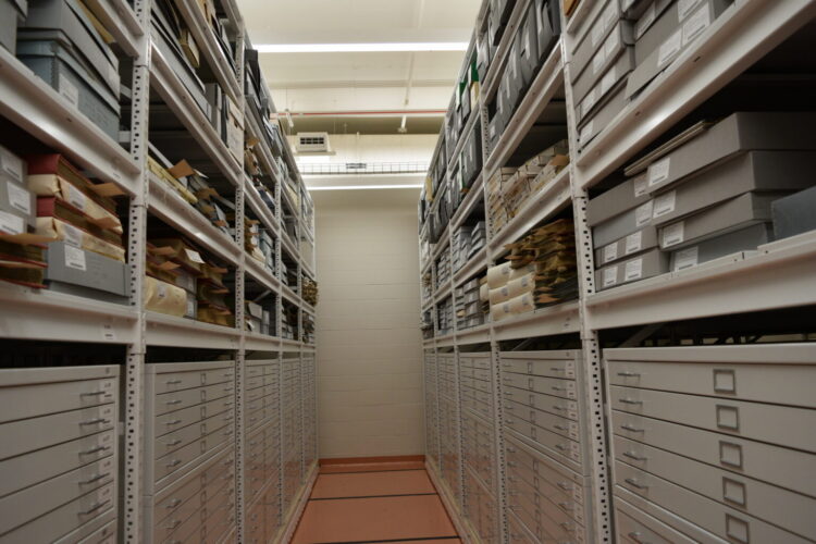 Shelves nearly to the ceiling hold the state's historic documents.