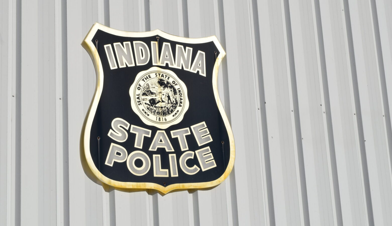 The Indiana State Police logo on the side of a building.
