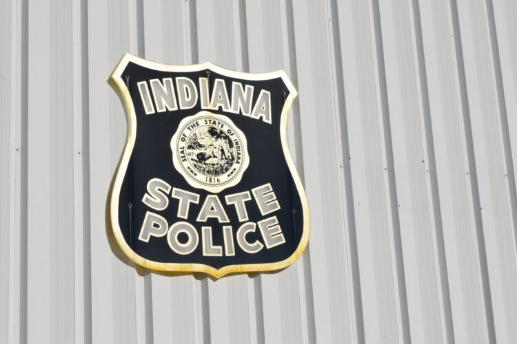 The Indiana State Police logo on the side of a building.