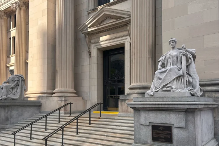 The U.S District Court for Southern Indiana is in the Birch Bayh Federal Building on East Ohio Street in downtown Indianapolis. The photo shows steps leading to a doorway situated between two statues.