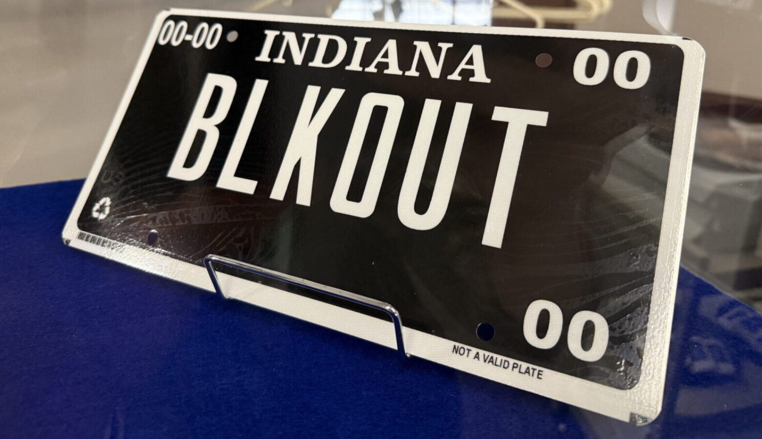 A so-called blackout license plate is a black plate with white letters and a white border.