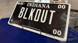 A so-called blackout license plate is a black plate with white letters and a white border.