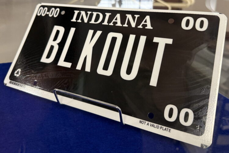 A so-called blackout license plate is a black plate with white letters and a white border.