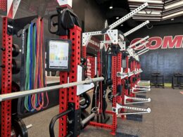 Rows of workout benches. Each of them as a small digital tablet fixed to them.