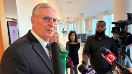 Greg Ballard speaks to reporters outside an Indianapolis courtroom.