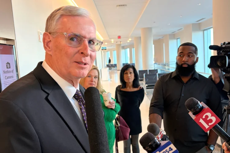 Greg Ballard speaks to reporters outside an Indianapolis courtroom.